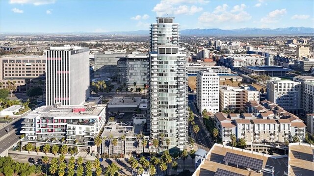 property's view of city with a mountain view