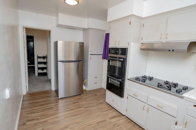 kitchen featuring white cabinetry, light hardwood / wood-style floors, and black appliances