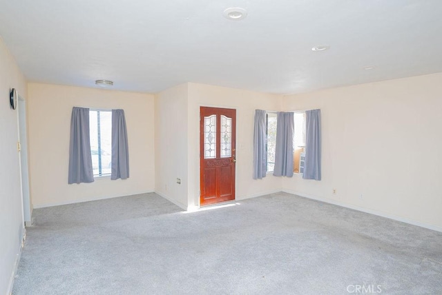 view of carpeted entrance foyer