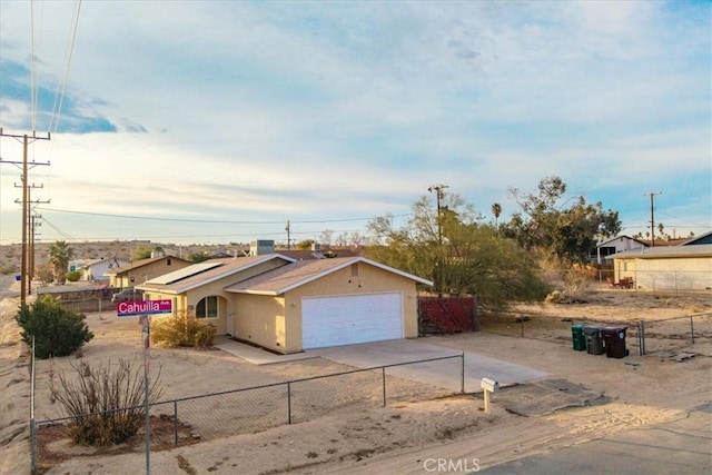 single story home with a garage