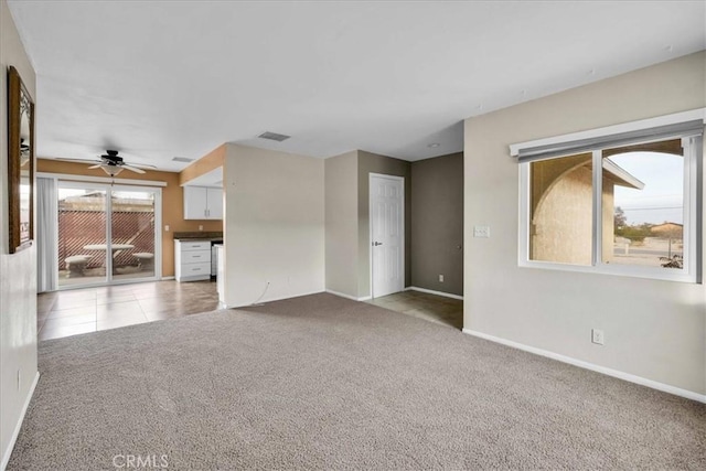 unfurnished living room with light carpet and ceiling fan