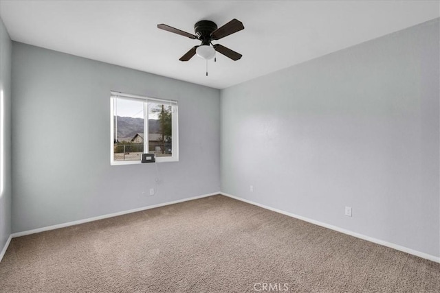 unfurnished room with carpet floors and ceiling fan