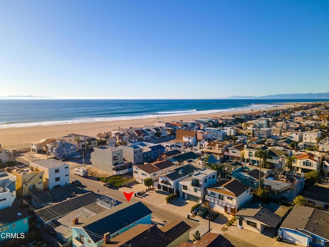 birds eye view of property featuring a water view and a view of the beach