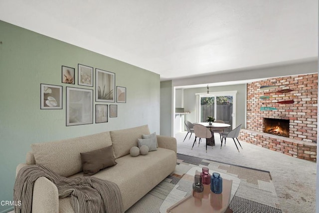 living room featuring carpet flooring and a fireplace