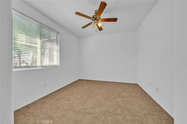 carpeted empty room with ceiling fan