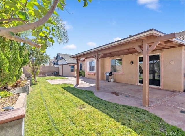 view of yard featuring a patio and a storage shed