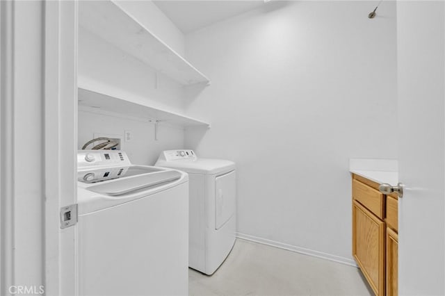 clothes washing area featuring washing machine and clothes dryer