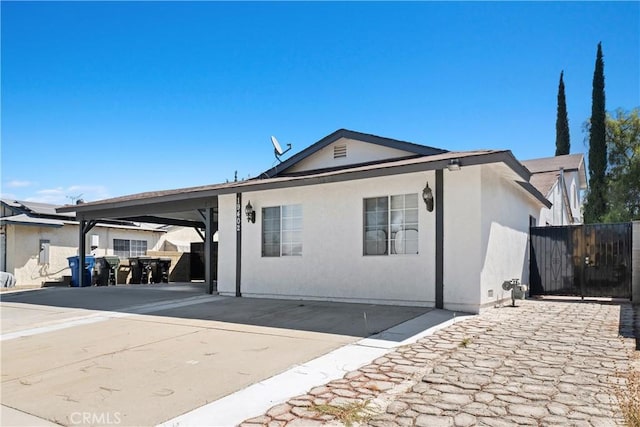 ranch-style home with a carport