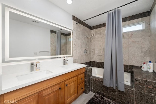 bathroom with vanity and shower / tub combo