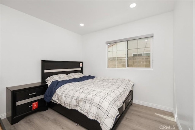 bedroom with light wood-type flooring