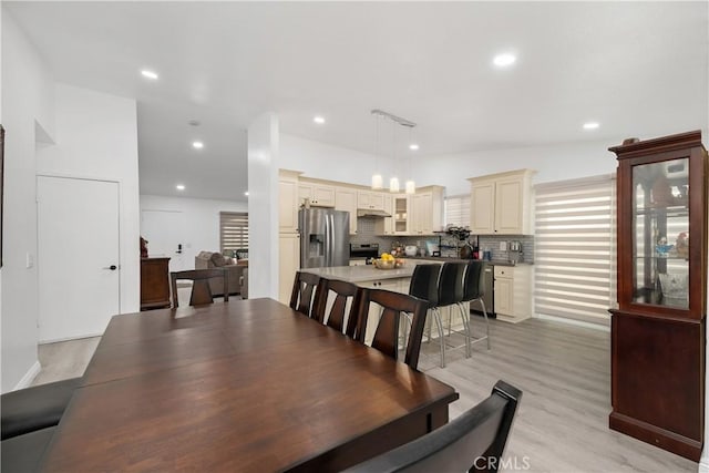 dining area with light hardwood / wood-style flooring