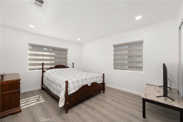 bedroom with light hardwood / wood-style flooring