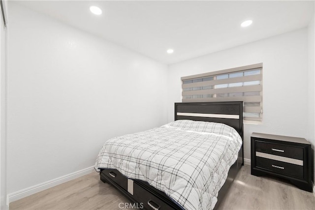 bedroom with light wood-type flooring