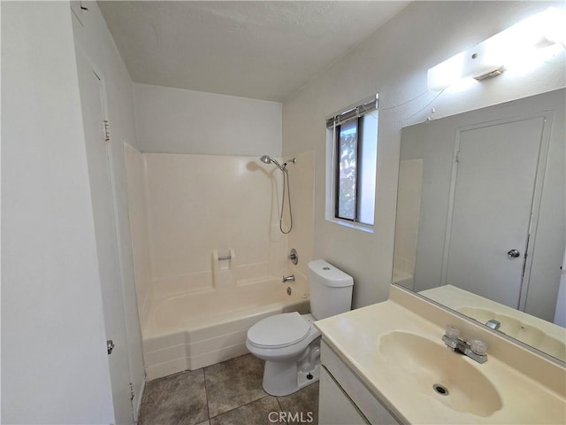 full bathroom featuring tile patterned floors, vanity, shower / bathtub combination, and toilet