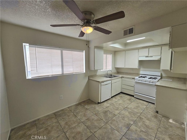 kitchen with a textured ceiling, white appliances, ceiling fan, sink, and white cabinets