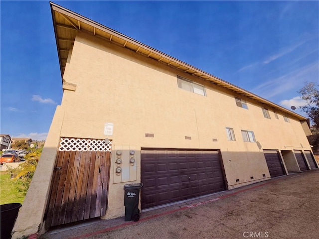 view of property exterior featuring a garage