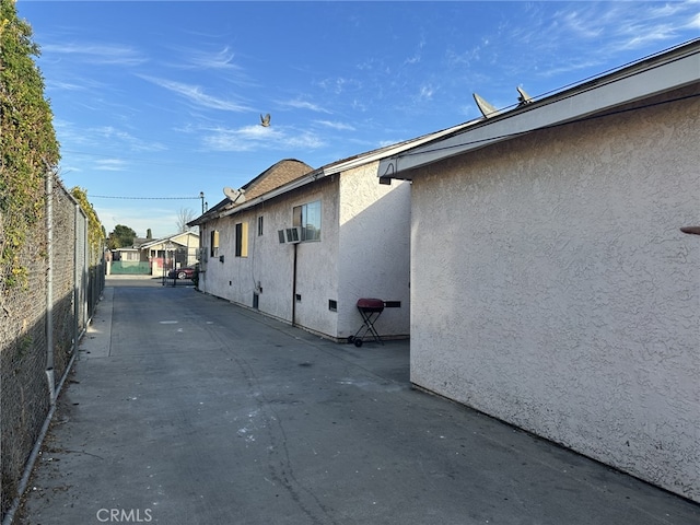 view of side of home featuring a patio area