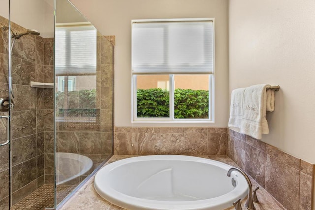 bathroom with shower with separate bathtub