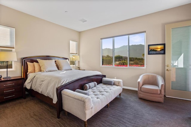 carpeted bedroom featuring a mountain view