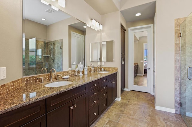 bathroom with vanity and an enclosed shower