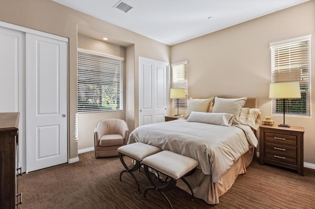 bedroom featuring dark carpet