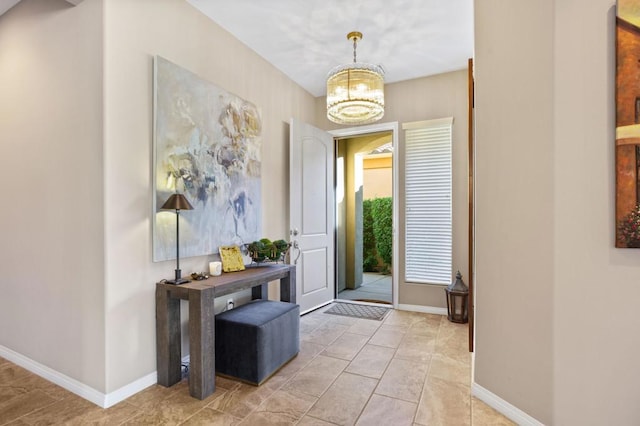 foyer with an inviting chandelier