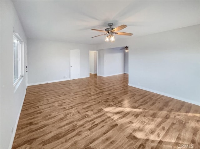 spare room with hardwood / wood-style floors and ceiling fan