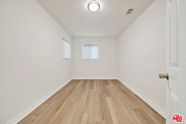 unfurnished room featuring light hardwood / wood-style floors