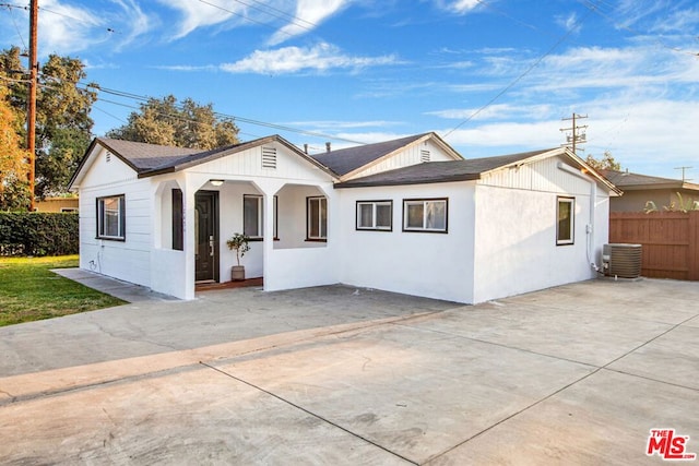 ranch-style house with central AC and a patio area