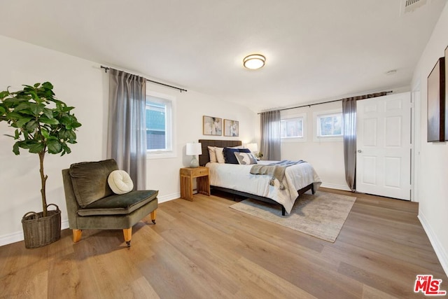 bedroom with light hardwood / wood-style floors