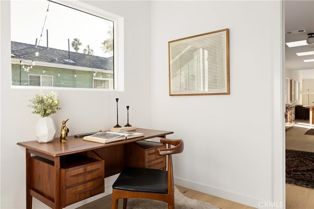 office area with light wood-type flooring