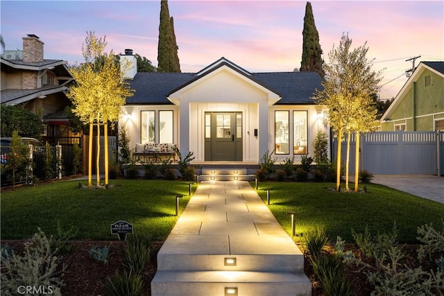 view of front of house with a lawn