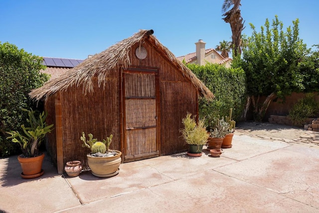 view of outbuilding with solar panels