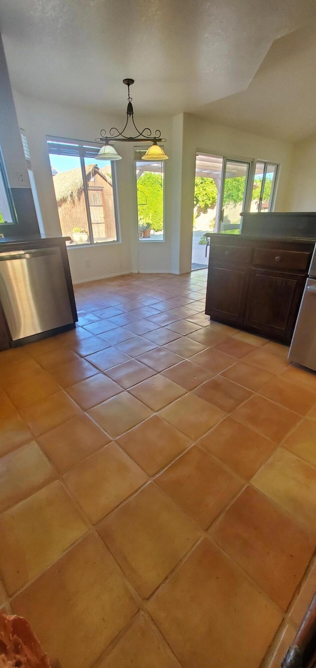 unfurnished dining area featuring light tile patterned floors