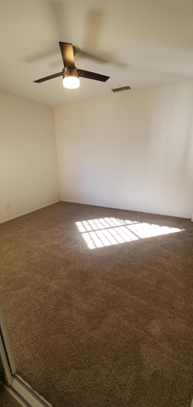 carpeted empty room with ceiling fan