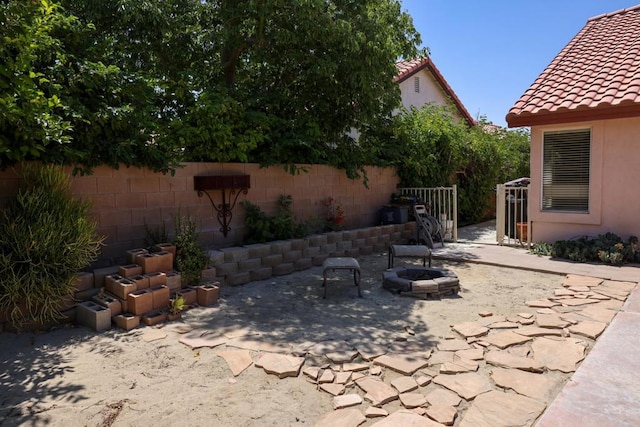 view of patio / terrace featuring a fire pit