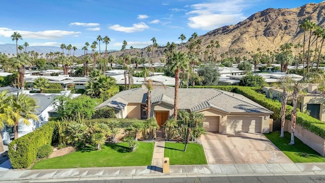 birds eye view of property with a mountain view