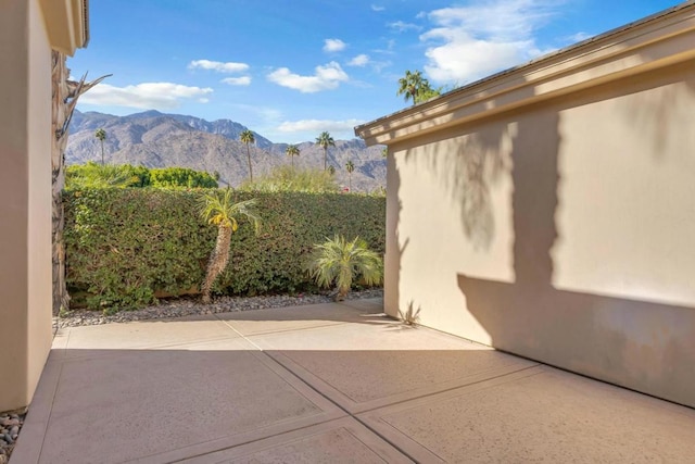 view of patio / terrace with a mountain view