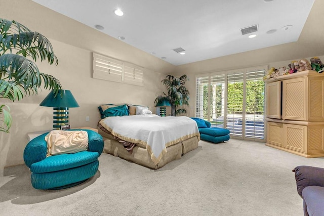 carpeted bedroom featuring access to outside