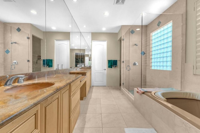 bathroom with vanity, tile patterned floors, and independent shower and bath