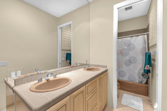 full bathroom featuring toilet, vanity, tile patterned flooring, and shower / bath combination with curtain