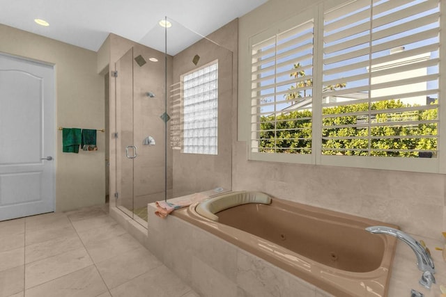 bathroom with shower with separate bathtub, a healthy amount of sunlight, and tile patterned floors