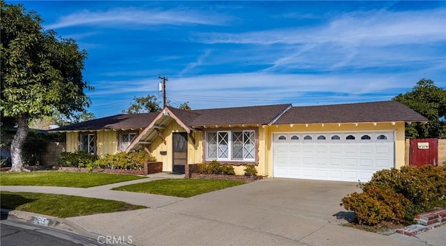 ranch-style home with a front lawn and a garage