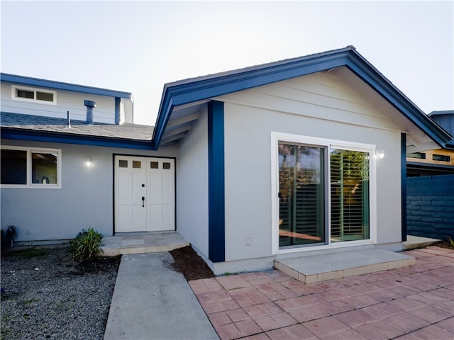 entrance to property with a patio