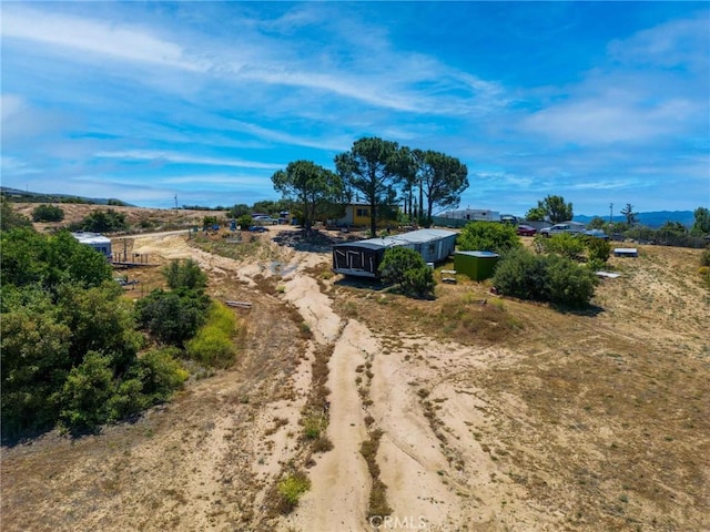 birds eye view of property with a rural view