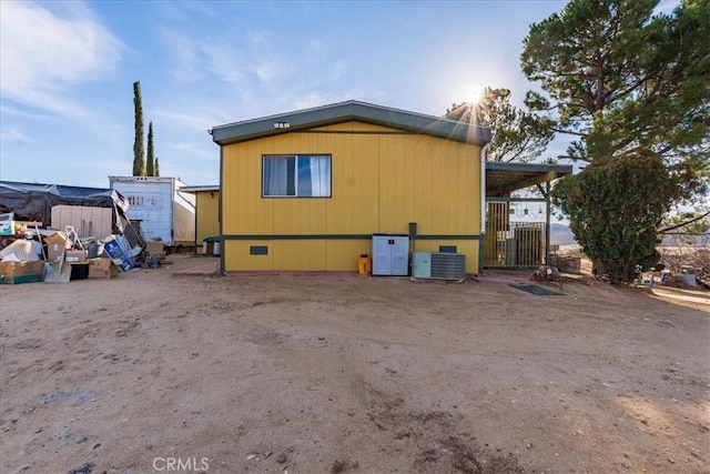 view of side of property with central AC unit