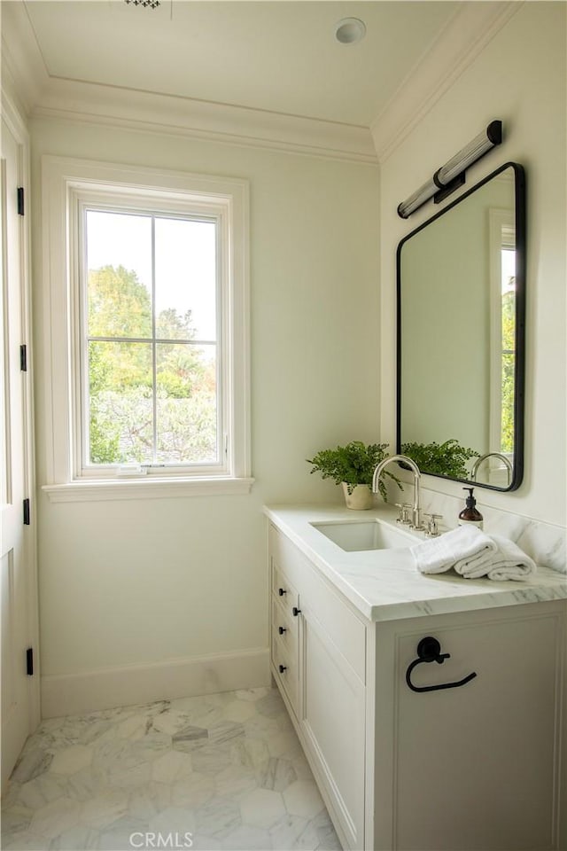 bathroom featuring crown molding and vanity