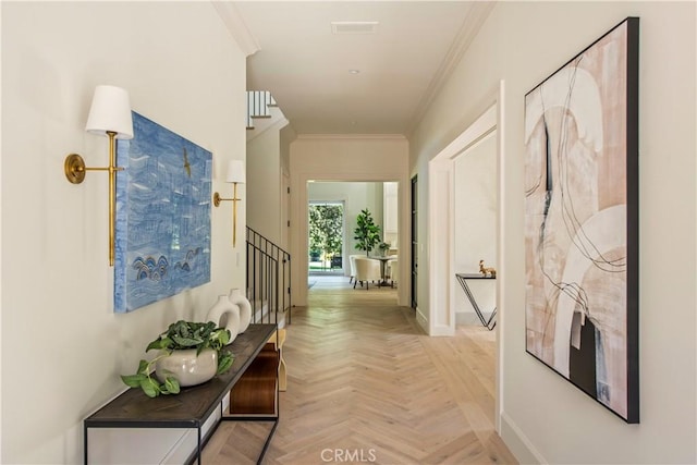 hallway with light parquet flooring and crown molding