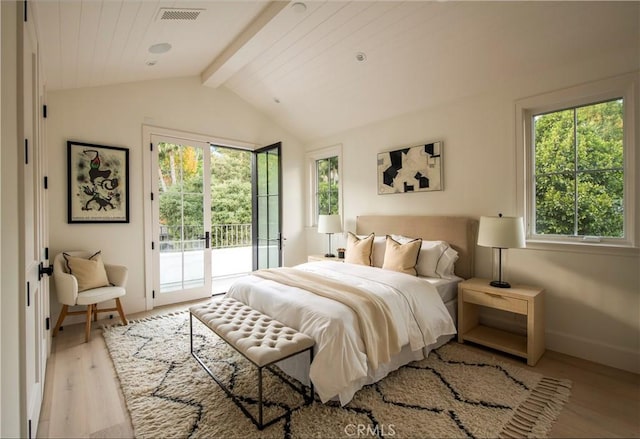 bedroom featuring lofted ceiling with beams, access to exterior, light wood-type flooring, and multiple windows