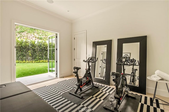 workout area with golf simulator and ornamental molding